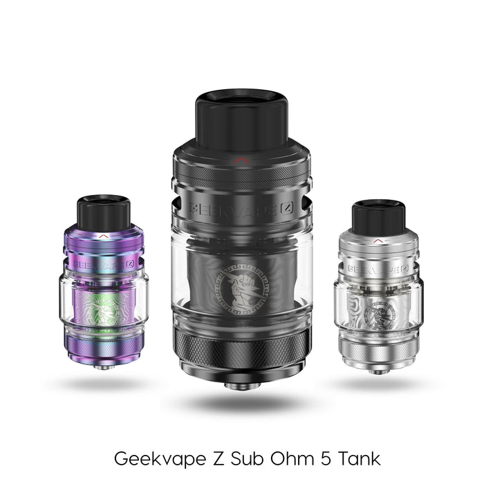 Three Geekvape Z Sub Ohm Tank 5 units in purple, black, and silver are shown with the label “Geekvape Z Sub Ohm Tank 5.” These tanks by Geekvape are compatible with Z Series Boost coils. Available at Vape Direct In Milton Keynes