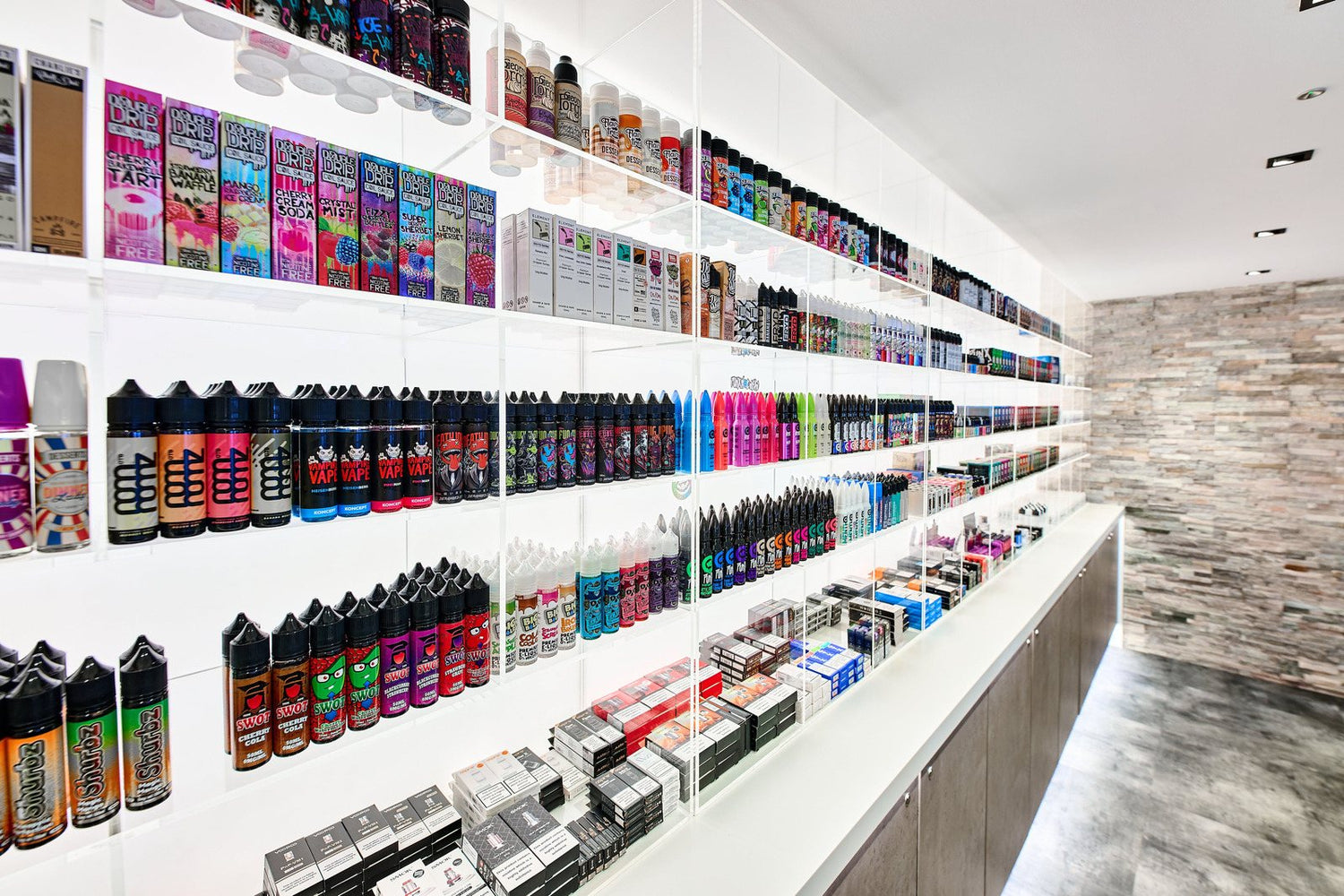 Shelves at Vape Direct Neath Hill, Milton Keynes, stocked with e-liquids and vaping products